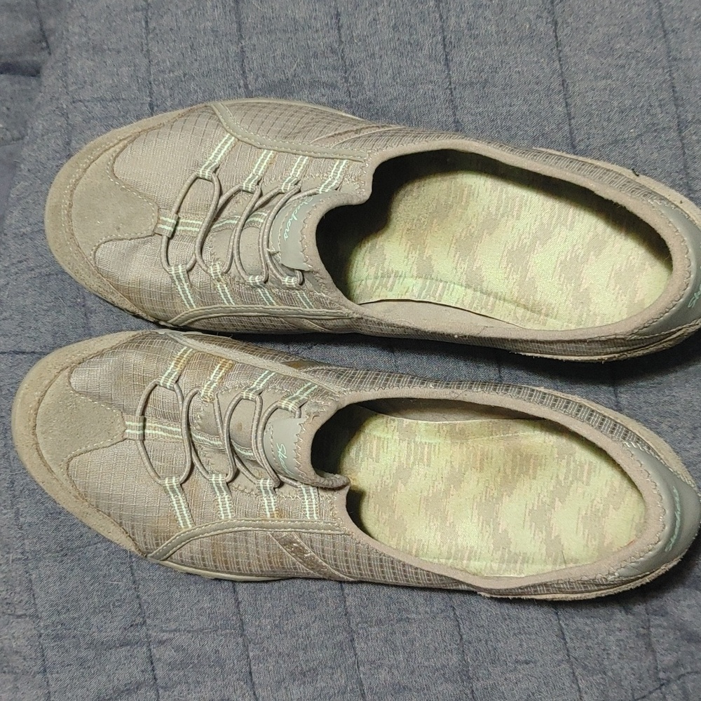 Women's Skechers walking shoes. Grey in color.